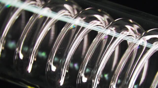 Close-Up of Clear Plastic Spiral Binding Spines on a Notebook