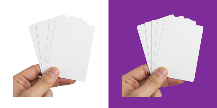 A hand holding a stack of blank white playing cards for game design