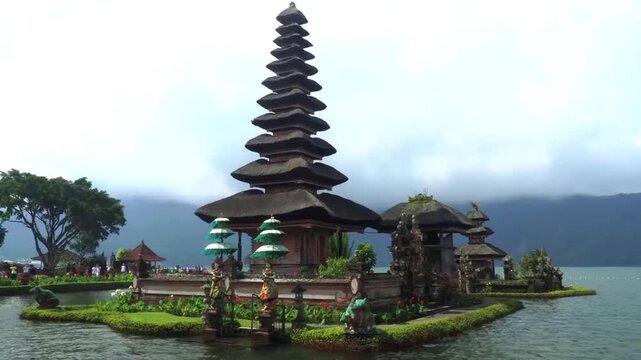 Pura Ulun Danu Beratan temple on Lake Beratan, Bedugul Bali Indonesia, iconic 11 tiered meru shrine floating on water with misty mountains background