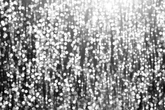 Silver glitter bokeh background with sparkling texture