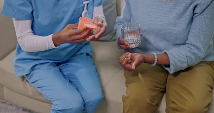 Hands, old person or nurse with pill help, health treatment or medication plan in elderly center. Medical, caregiver or senior woman with water, recovery prescription or dosage aid in nursing home.