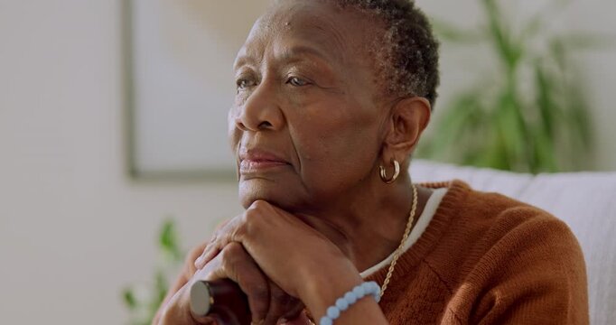 Senior, woman and thinking in home for retirement, nostalgia or mindfulness with reflection in lounge. African person, memory and serious calm with history, past and remember with pension mindset