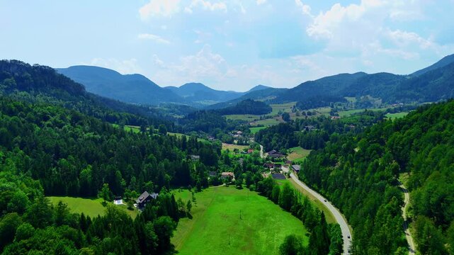 Landscape view of mountains, valleys and village in southern Germany. Mountains and valleys surround a small village in southern Germany.