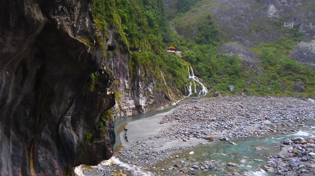 Memorial Changchun Shrine Taoist Temple and Eternal Waterfall Spring on the Rocks of Taroko Gorge National Park in Taiwan  - Side Angle LS UHD 4K