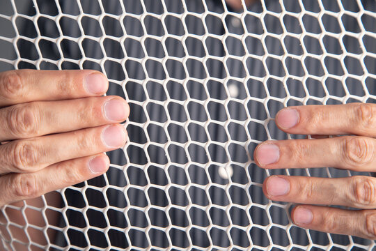 Man showing a plastic net structure.