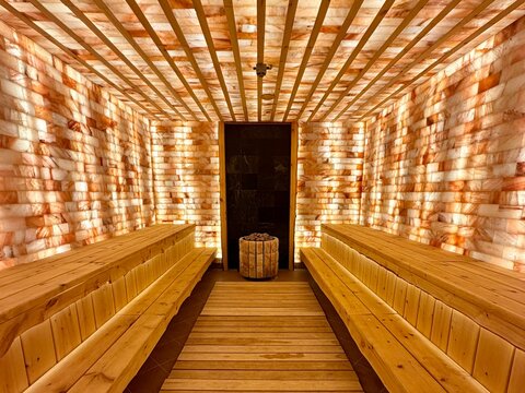 Salt Room Interior with Himalayan Salt Brick Walls and Wooden Benches