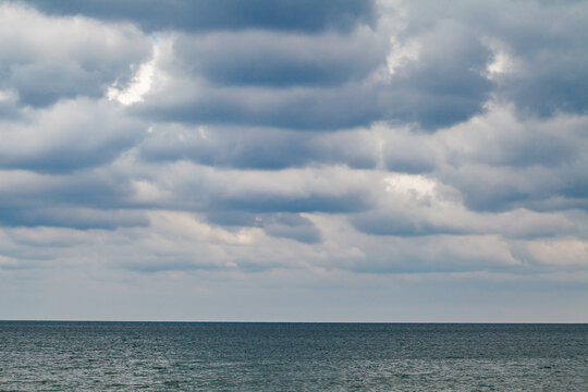 solid clouds above the sea surface
