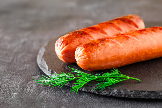 grilled sausages on slate stone, selective focus