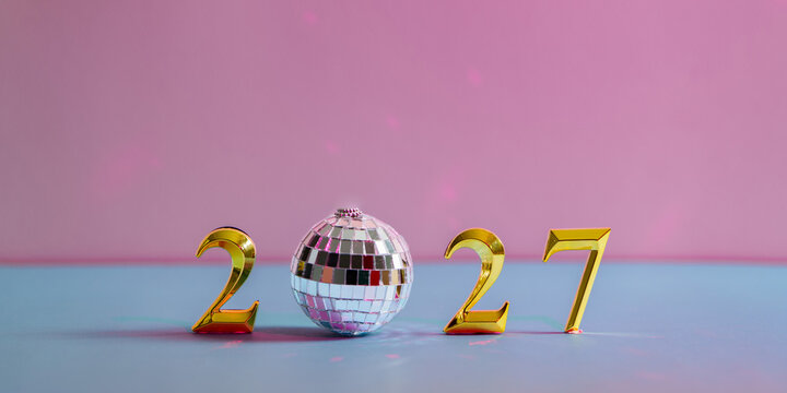 Golden 2027 numbers with disco ball for New Year party celebration
