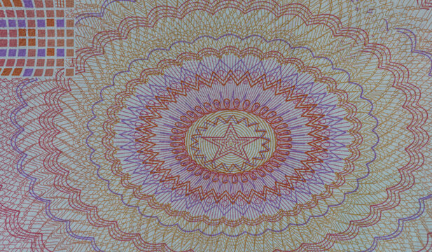 Macro close up of guilloche security pattern with star element on Chinese yuan banknote