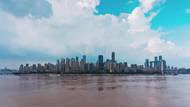 Chongqing City Skyline with Modern Skyscrapers and River Under Cloudy Sky in China in Chongqing, China