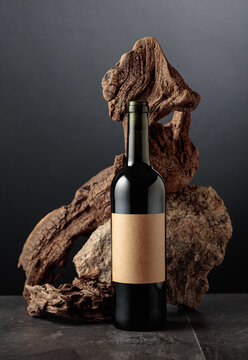 Red wine with old snag and a piece of granite rock.