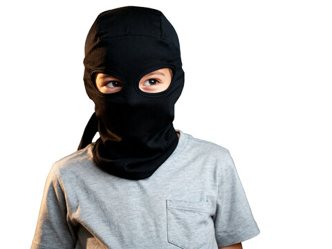 Mysterious child, brown eyes in black balaclava, grey t-shirt, isolated on transparent, ideal for Halloween secret agent or anonymity.