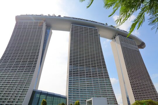 SINGAPORE CITY, SINGAPORE - MARCH 11, 2024: Landmark Marina Bay Sands hotel, casino and resort in Singapore City. It was designed by Moshe Safdie architects.