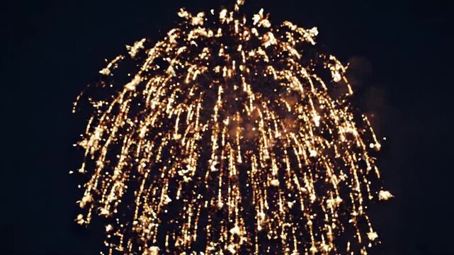 Abstract New Year fireworks represented by delicate golden light particles exploding from the center, deep navy background, elegant symmetrical composition, sophisticated celebration concept.