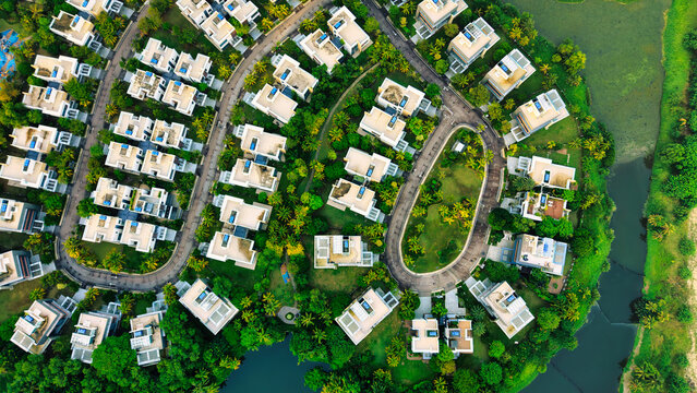 Aerial view of the Forest City residential development featuring modern houses nestled among lush greenery and winding roads in Gelang Patah, Johor Darul Ta'zim, Malaysia.