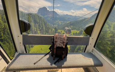 Obraz premium backpack on a cable car in the Dolomites