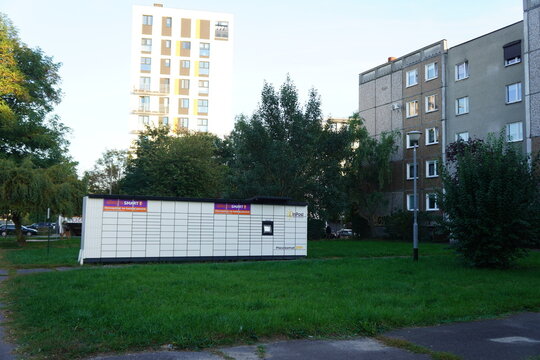 InPost parcel locker station situated in a residential area with modern and old apartment blocks