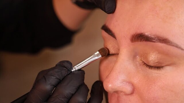 close up makeup application on face with brush