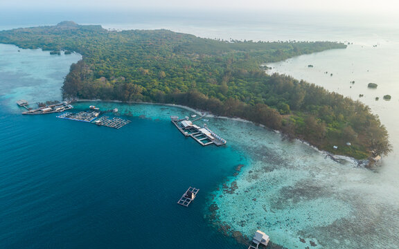 Aerial view of Menjangan Besar Island featuring shark breeding enclosures in the turquoise waters of the Karimunjawa archipelago, Karimunjawa, Jawa Tengah, Indonesia.