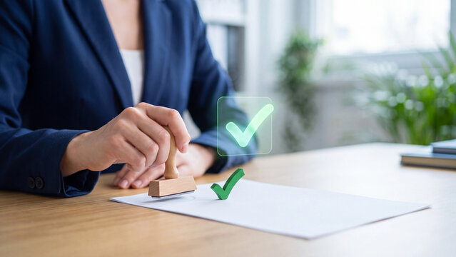 Document approval and certification stamp concept, businesswoman stamping blank paper with wooden rubber stamp and green check mark for contract verification, quality assurance and confirmation