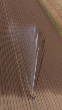 Aerial View Agricultural Irrigation Reel Watering Vegetable Field in Italy