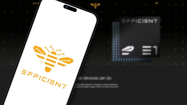 Izmir, Turkey - 30 Sep 2026: Efficient Computer logo on a tilted smartphone screen in front of the blurred company website showing its E1 processor, an energy efficient semiconductor startup