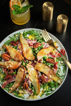 Salad with Pear, Arugula, Jamon, Blue Cheese and Blueberry, Delicious Fresh Salad Appetizer on Bright Background