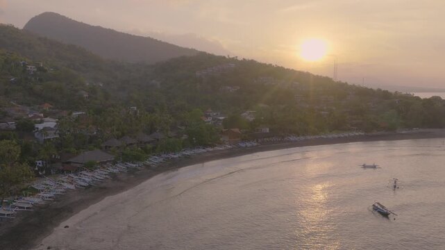 Beautiful aerial sunset over lipah beach in amed bali