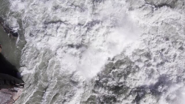 Powerful White Water Rapids Crashing in a Fast-Flowing River