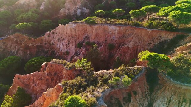 Aerial rocks and cliffs seascape shore view of beach, Algarve. Praia do Barranco das Belharucas