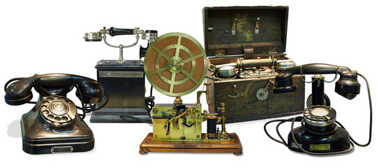 Old telephones, telegraph apparatus, portable telephone apparatus in wooden case isolated on white, collage © Pavel Losevsky