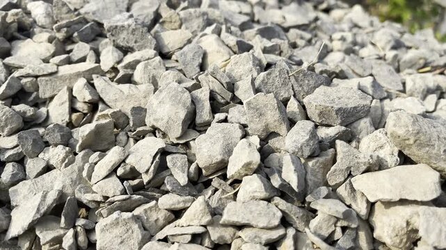 Pile of crushed stones and gravel texture background for construction