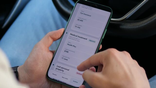 User reviews insurance claim history on a smartphone, showing approved, declined and pending cases as digital insurers automate claims, policy servicing and risk decisions.