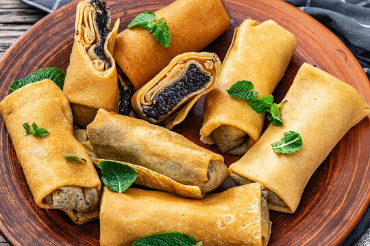 Sweet thin crepe rolls stuffed with poppy seed