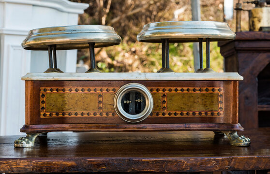 antique two-pan scale with a decorated wooden structure