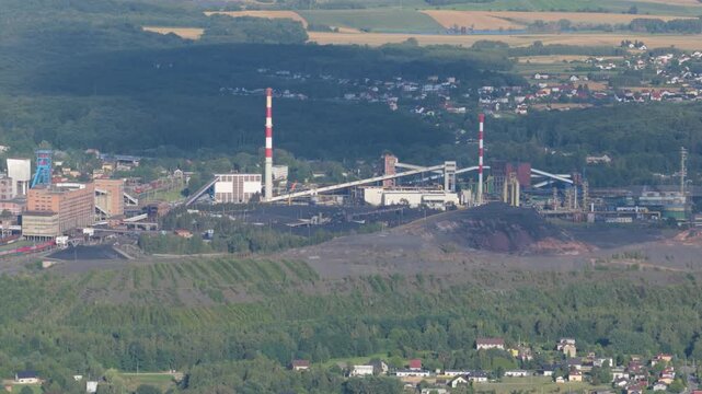 Industrial coal mine and power plant complex with slag heaps aerial view