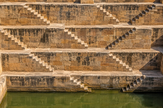 Stepwell wall with zigzag flights of sandstone steps on terraces