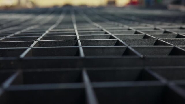 Close up of plastic ground reinforcement grid prepared for soil filling