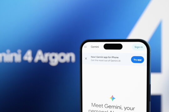 The Gemini website displayed on a smartphone screen with an image from the official announcement in the background. Google unveils its new Gemini 4 Argon AI model. October 1, 2026, Lisbon, Portugal.