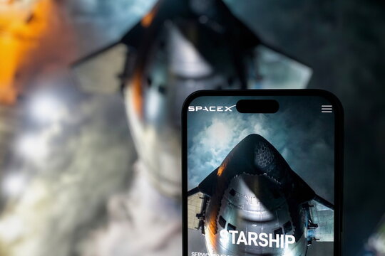 The Starship website displayed on a smartphone screen. SpaceX's Starship rocket reaches Earth orbit for the first time before splashing down in the Pacific Ocean. September 30, 2026, Lisbon, Portugal.