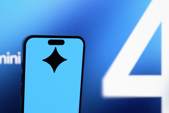 Low-angle view: the Gemini logo displayed on a smartphone screen. Google unveils its new Gemini 4 Argon AI model. October 1, 2026, Lisbon, Portugal.