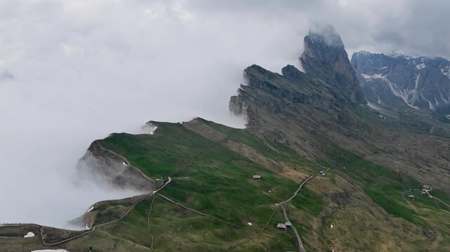 Cloudy weather over Seceda mountain ridge, aerial Dolomites landscape