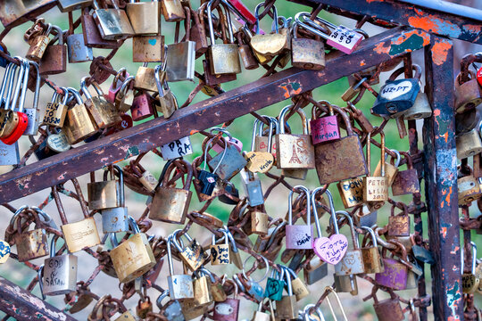 Love locks on fence in Montmartre Paris symbol of romance and tourism