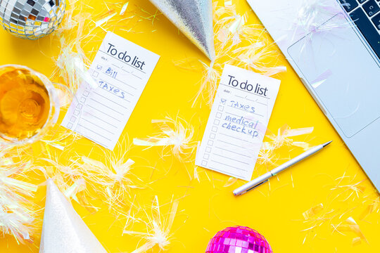 Work with fun. Laptop and to do lists with confetti and disco balls. Admin night party concept