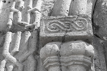 Obraz premium Close-up of a weathered stone carving showing ornamental relief and textured masonry of medieval Haghpat Monastery built between the 10th and 13th century also known as Haghpatavank, Armenia