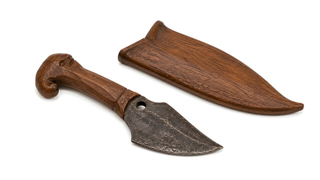 Traditional handcrafted dagger knife with patterned steel blade and wooden scabbard isolated on white background