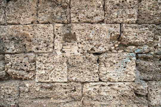 Side Ancient City. This photograph shows an ancient stone wall constructed from blocks of tuff or limestone, located at the Side Museum (Agora Baths).