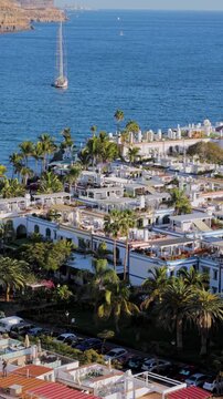 Paniramic vertical view of old town of Puerto de Mogan, harbor and colorful buildings, Gran Canaria, Canary Islands, Spain, Atlantic, Europe