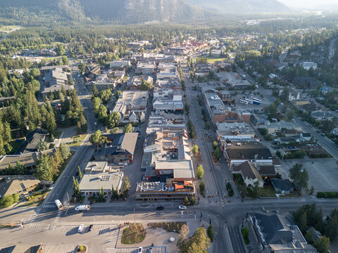 Wide aerial shot of Banff village surrounded by Rocky Mountain peaks